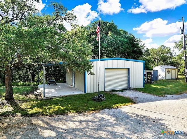 661 Abels Way, Canyon Lake, TX 78133 - garage with a detached garage and driveway
