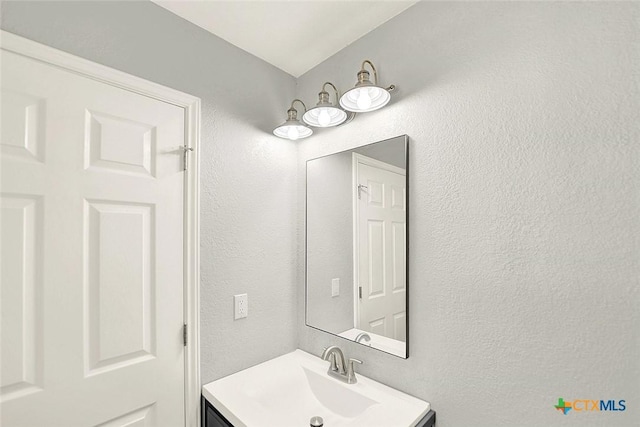661 Abels Way, Canyon Lake, TX 78133 - bathroom with vanity and a textured wall