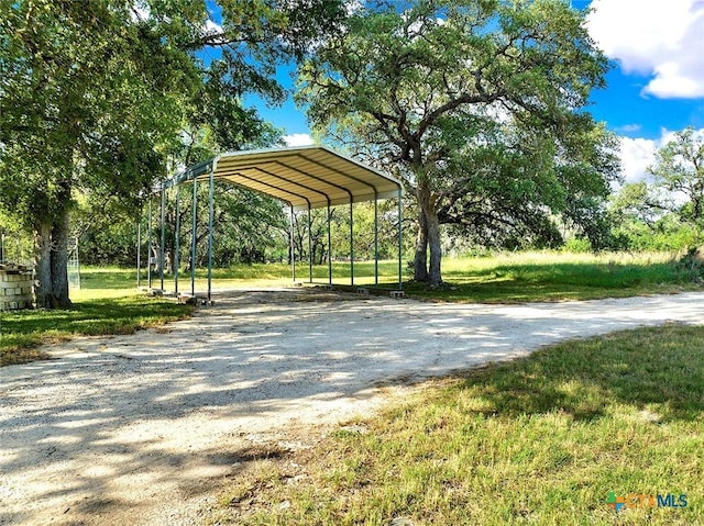 661 Abels Way, Canyon Lake, TX 78133 - view of home's community with driveway, a carport, and a lawn