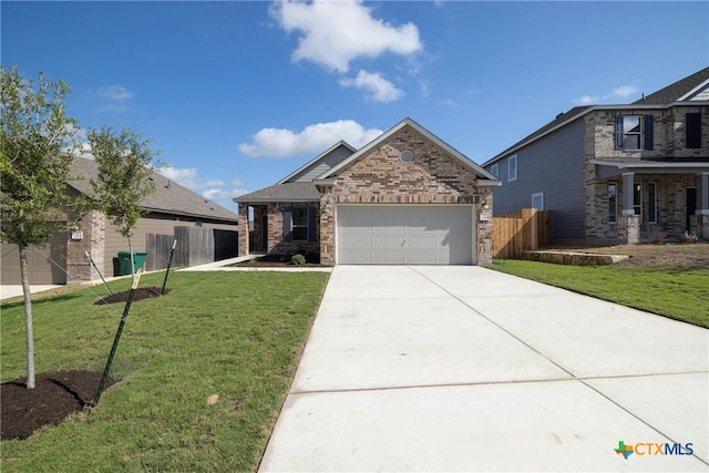 view of front of home featuring a front lawn and a garage