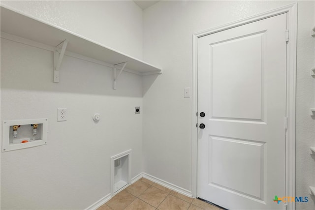 clothes washing area with hookup for a gas dryer, hookup for a washing machine, light tile patterned floors, and hookup for an electric dryer