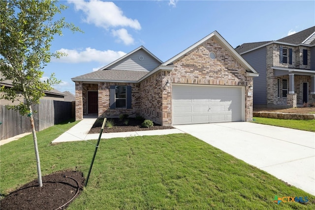 view of front facade featuring a front yard and a garage