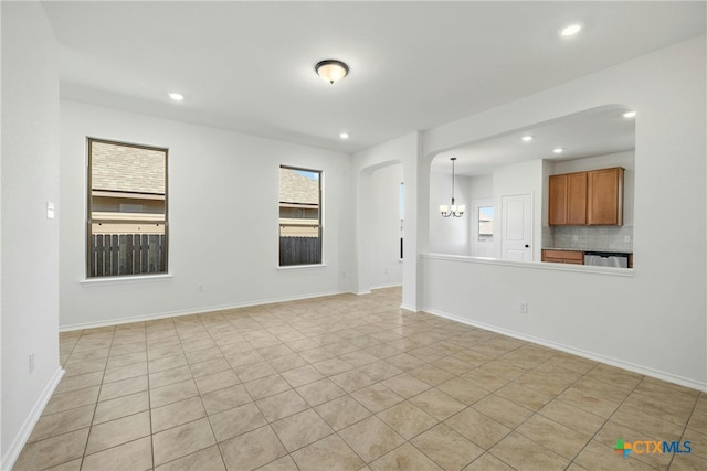 unfurnished living room with light tile patterned floors