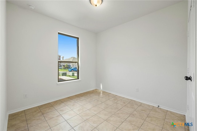 empty room featuring light tile patterned flooring