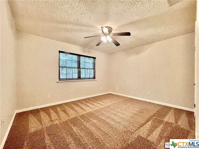 carpeted empty room featuring a textured ceiling and ceiling fan