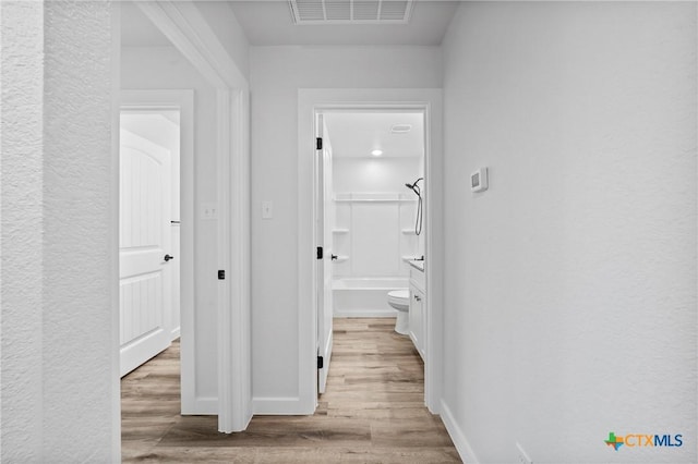 616 S 24th St, Temple, TX 76501 - hallway featuring light wood-type flooring and baseboards