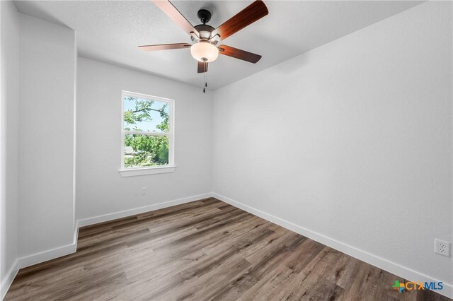 616 S 24th St, Temple, TX 76501 - empty room with baseboards, a ceiling fan, and wood finished floors