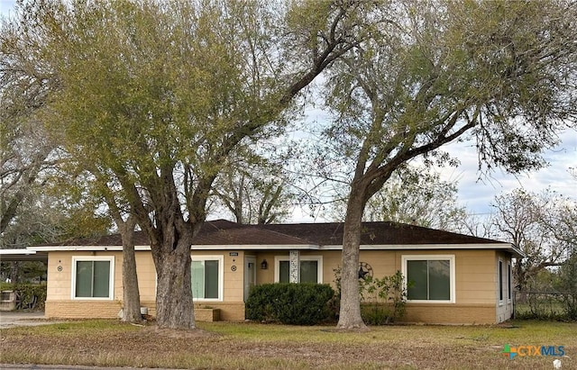 ranch-style home with a carport