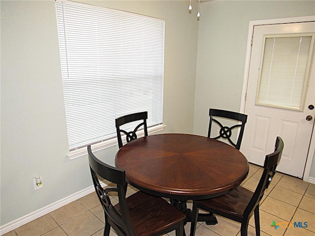 1104 N Blair St, Belton, TX 76513 - dining room featuring light tile patterned flooring and baseboards