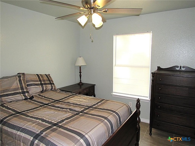 1104 N Blair St, Belton, TX 76513 - bedroom with multiple windows, wood finished floors, and ceiling fan