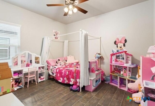 1606 Fiddle Wood Way, Temple, TX 76502 - bedroom with wood finished floors and a ceiling fan