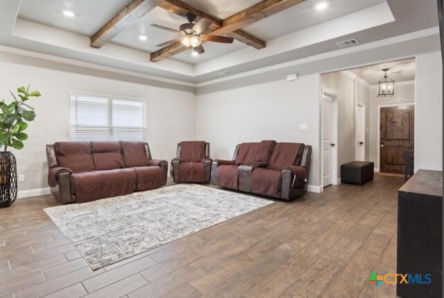 1606 Fiddle Wood Way, Temple, TX 76502 - living room with a tray ceiling, wood finished floors, ceiling fan, beamed ceiling, and coffered ceiling