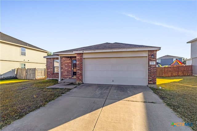 view of front facade featuring a garage and a front lawn