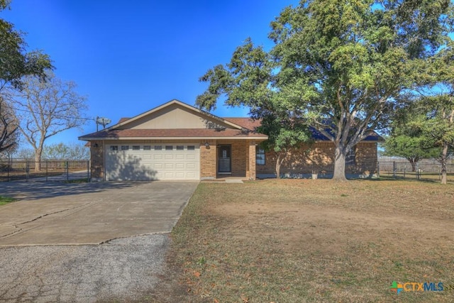 ranch-style house featuring a garage