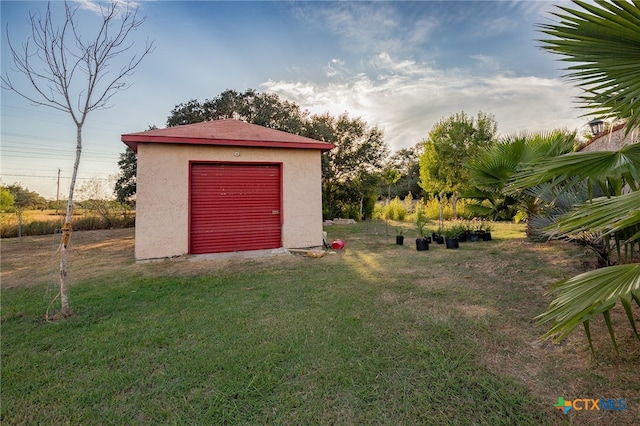 garage with a lawn