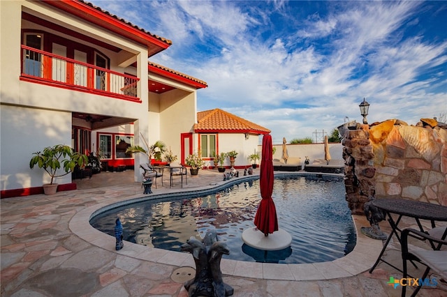 view of pool with a patio