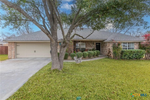 single story home featuring a garage and a front yard