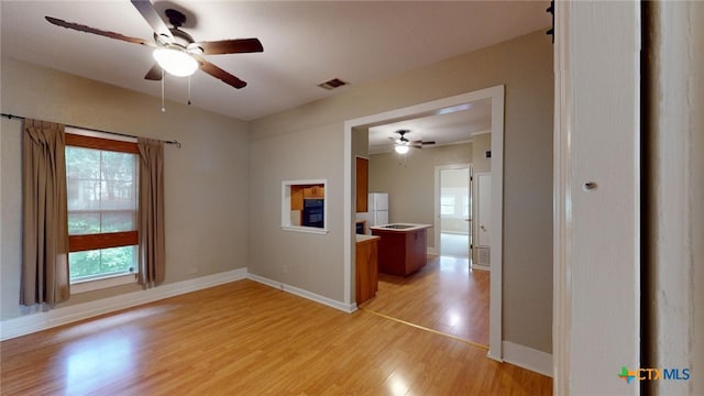 spare room featuring light wood-type flooring