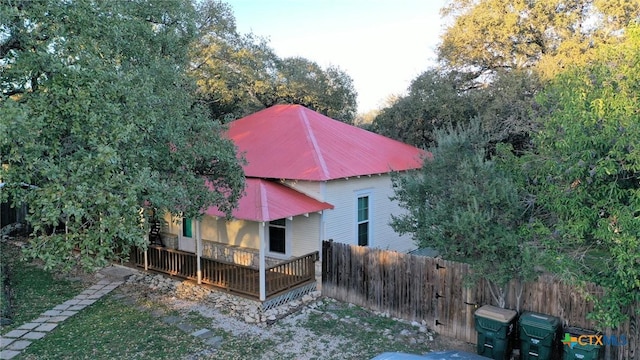 view of home's exterior featuring a wooden deck