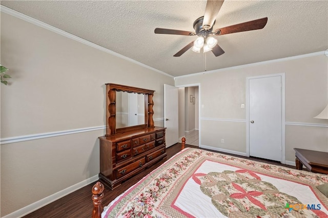 bedroom featuring crown molding, a textured ceiling, and wood finished floors