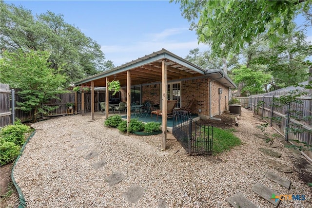 exterior space featuring cooling unit and a fenced backyard