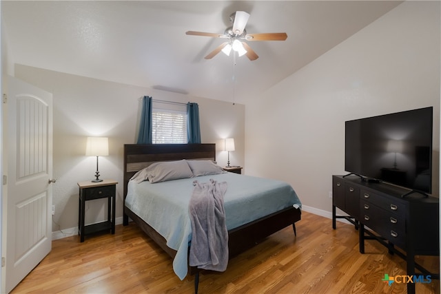 2265 Candlelight Dr, Canyon Lake, TX 78133 - bedroom with light wood-type flooring, lofted ceiling, and ceiling fan