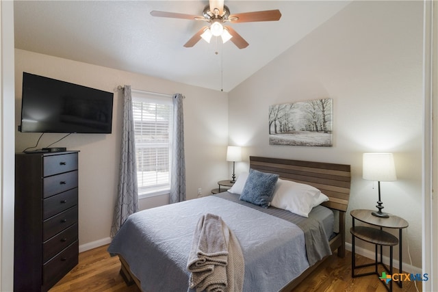 2265 Candlelight Dr, Canyon Lake, TX 78133 - bedroom featuring wood finished floors, vaulted ceiling, and ceiling fan