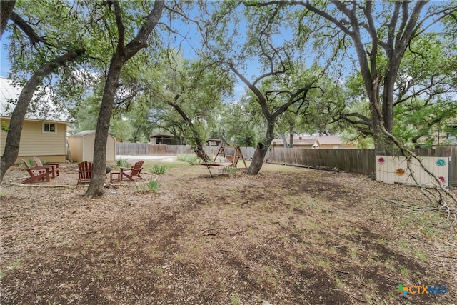 2265 Candlelight Dr, Canyon Lake, TX 78133 - fenced backyard featuring a storage shed