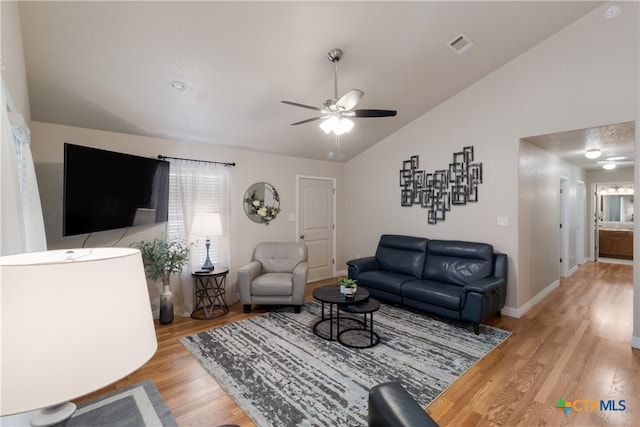 2265 Candlelight Dr, Canyon Lake, TX 78133 - living room featuring vaulted ceiling, a ceiling fan, and light wood-style flooring