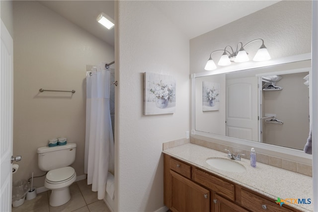 2265 Candlelight Dr, Canyon Lake, TX 78133 - bathroom featuring vanity, tile patterned floors, and lofted ceiling