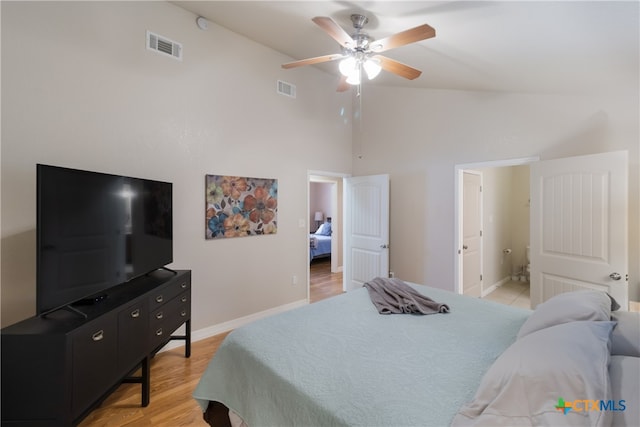 2265 Candlelight Dr, Canyon Lake, TX 78133 - bedroom with high vaulted ceiling, light wood-type flooring, a ceiling fan, and ensuite bathroom