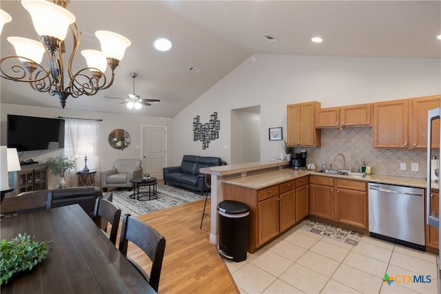 2265 Candlelight Dr, Canyon Lake, TX 78133 - kitchen with stainless steel dishwasher, open floor plan, light countertops, a ceiling fan, and high vaulted ceiling