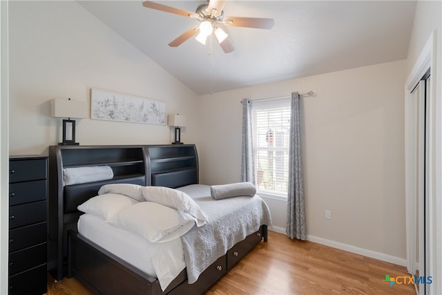 2265 Candlelight Dr, Canyon Lake, TX 78133 - bedroom with wood finished floors, lofted ceiling, ceiling fan, and a closet