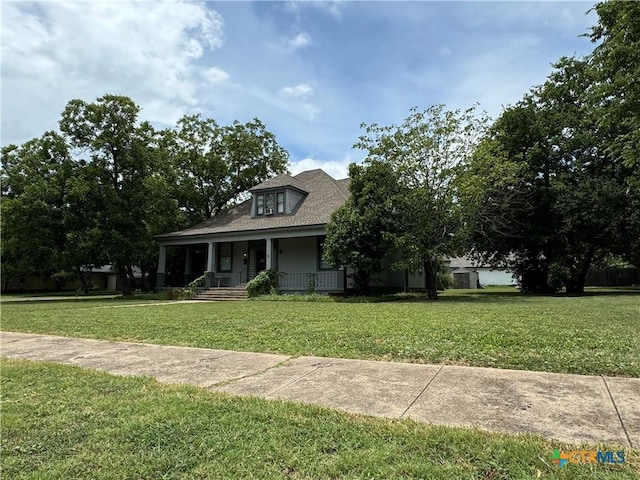 906 N Penelope St, Belton, TX 76513 - view of front of property featuring a porch, a front yard, and roof with shingles