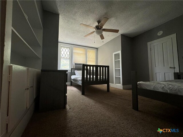 906 N Penelope St, Belton, TX 76513 - carpeted bedroom with a textured ceiling and a ceiling fan