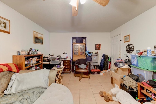 interior space with light tile patterned floors and ceiling fan