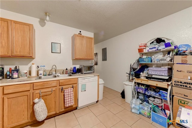 kitchen featuring light brown cabinetry, a textured ceiling, sink, light tile patterned floors, and dishwasher