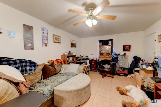 tiled living room with ceiling fan