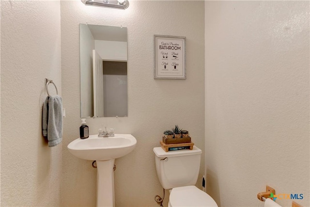 bathroom featuring toilet