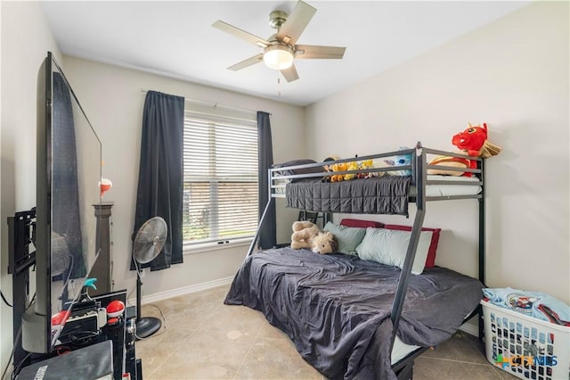 211 Amberglow Ct, Victoria, TX 77904 - tiled bedroom featuring baseboards and a ceiling fan