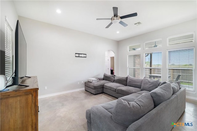 211 Amberglow Ct, Victoria, TX 77904 - living room featuring arched walkways, a ceiling fan, plenty of natural light, baseboards, and recessed lighting