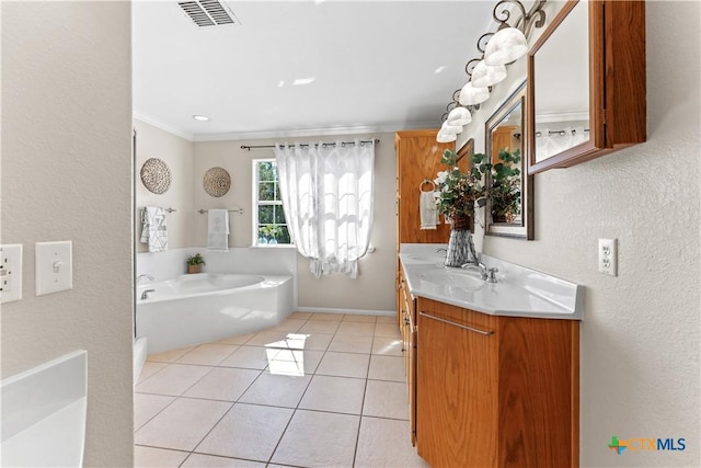 16047 Charlya Dr, Temple, TX 76502 - bathroom with a textured wall, vanity, a bath, tile patterned floors, and crown molding