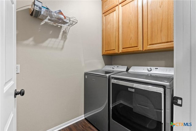 16047 Charlya Dr, Temple, TX 76502 - clothes washing area featuring washer and dryer, cabinet space, baseboards, and dark wood-style flooring