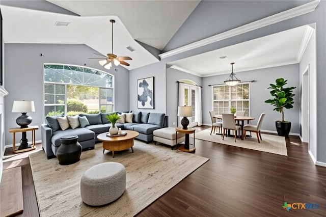 16047 Charlya Dr, Temple, TX 76502 - living area with vaulted ceiling, healthy amount of natural light, a ceiling fan, dark wood-type flooring, and baseboards