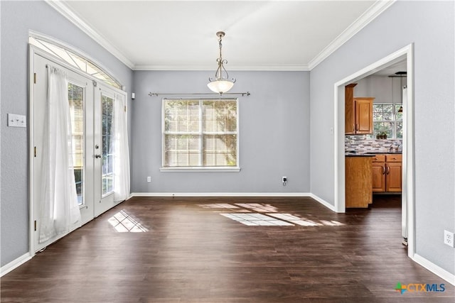 16047 Charlya Dr, Temple, TX 76502 - unfurnished dining area featuring french doors, crown molding, dark wood-type flooring, and baseboards