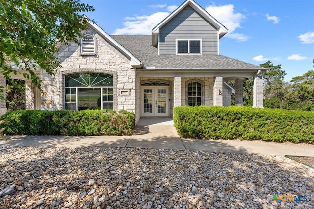 16047 Charlya Dr, Temple, TX 76502 - view of front facade with french doors, stone siding, and a shingled roof