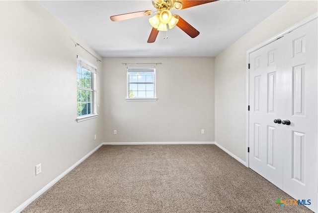 16047 Charlya Dr, Temple, TX 76502 - unfurnished bedroom featuring carpet floors, baseboards, and a ceiling fan