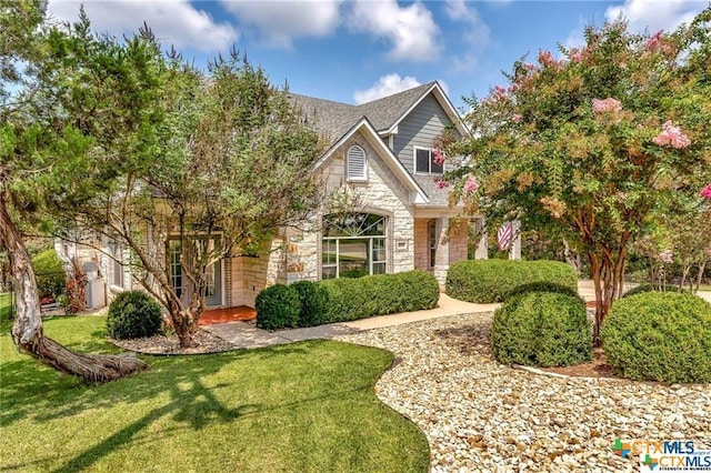 16047 Charlya Dr, Temple, TX 76502 - view of front facade featuring stone siding and a front yard
