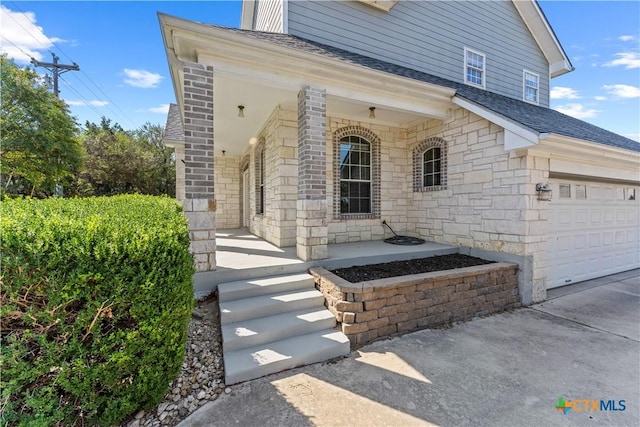 16047 Charlya Dr, Temple, TX 76502 - doorway to property featuring covered porch, roof with shingles, stone siding, and driveway