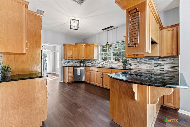 16047 Charlya Dr, Temple, TX 76502 - kitchen with dishwasher, dark wood finished floors, decorative backsplash, a peninsula, and a sink